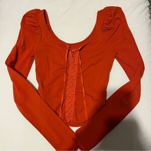 Free People Long Sleeve Scoop Neck Top in Orange